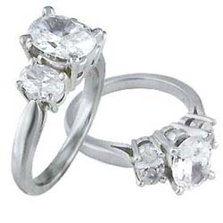 Oval cut three stone engagement ring
