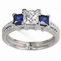 Hand engraved engagement ring with Sapphires