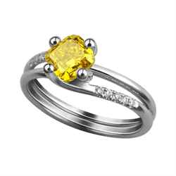 Fancy vivid yellow colored diamond in a ring