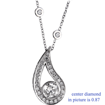 Drop pendant with surrounding diamonds