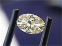 Natural Diamond 0.70 Carats, Oval with  Cut, M Color, VVS2 Clarity and Certified by IGI