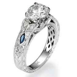 Hand engraved, vintage designers Engagement ring with blue Sapphires