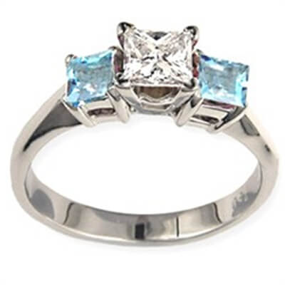 Engagement ring with Princess side Aquamarines