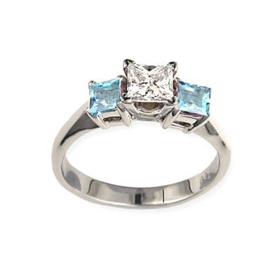 Engagement ring with Princess side Aquamarines