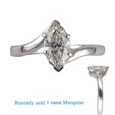 Low profile embracing ring for Marquise diamonds