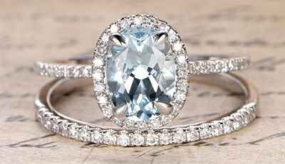 Conjunto nupcial de diamantes ovalados, en anillo halo