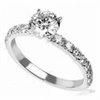 Engagement ring with open pave set accent diamonds