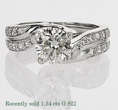 Twisted engagement ring with side Diamonds