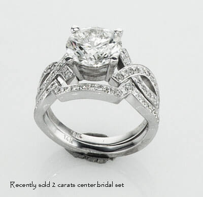 Bowtie engagement ring 0.25CTW side diamonds