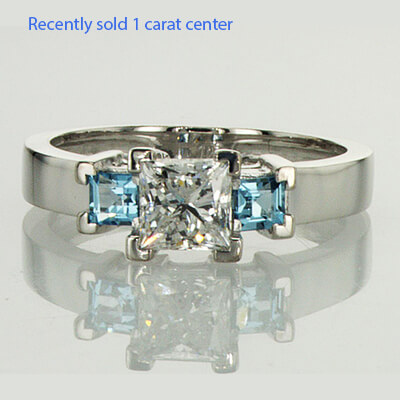 Two aquamarine side stones engagement ring