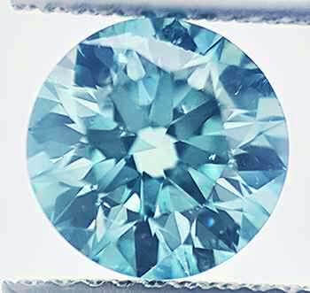 Picture of 1.54 Carats, Round Diamond with Ideal Cut, Blue color enhanced, SI1 NOT enhanced, Certified by IGL 