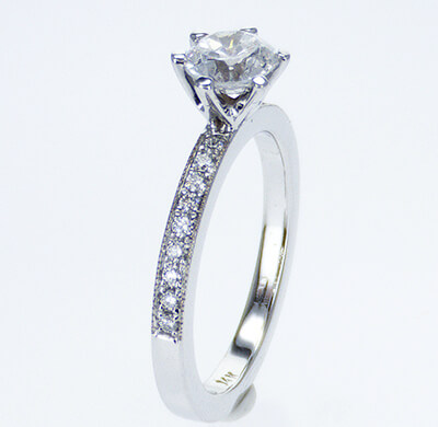 Pave set side diamonds Novo engagement ring