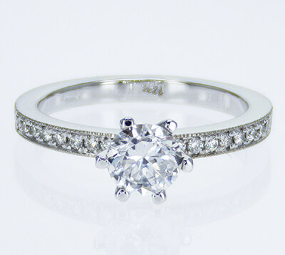 Pave set side diamonds Novo engagement ring