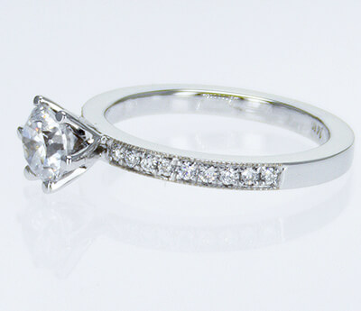 Pave set side diamonds Novo engagement ring