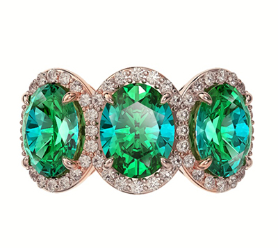 Three Emerald Ovals ring with side diamonds