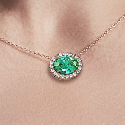 1 1/4 carat Oval Emerald and 1/5 carat diamonds pendant