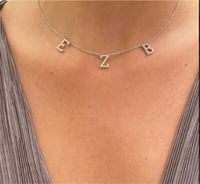 Three letters necklace, 0.50 carat diamonds average G color VS2 clarity
