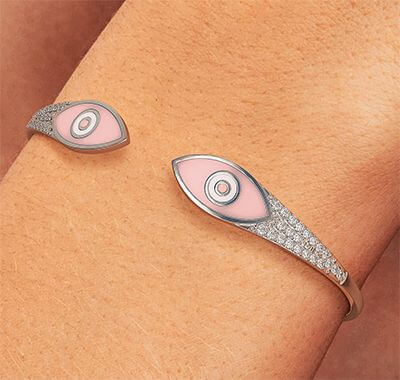 Solid Gold bangle with 0.65 carat diamonds and Enamel eyes