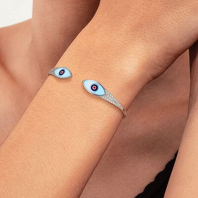 Solid Gold bangle with 0.65 carat diamonds and Enamel eyes