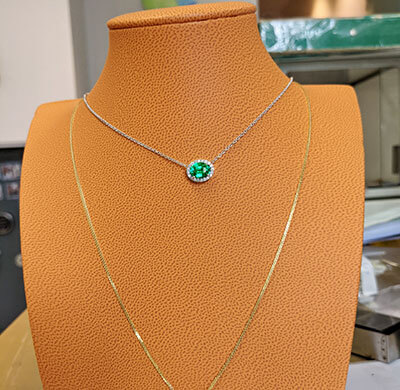 1 1/4 carat Oval Emerald and 1/5 carat diamonds pendant