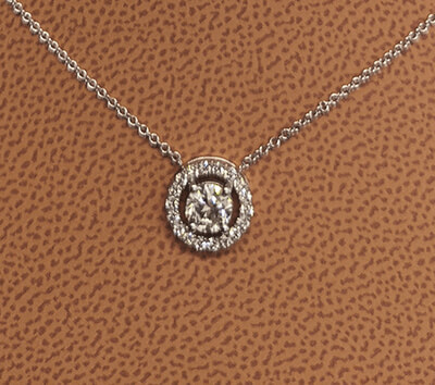 Diamond halo pendant, 0.50 center +0.20