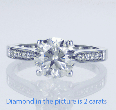 Cathedral engagement ring with side diamonds
