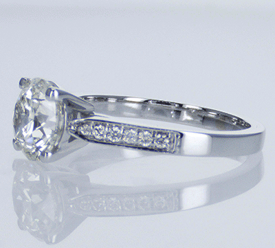 Cathedral engagement ring with side diamonds