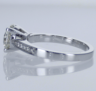 Cathedral engagement ring with side diamonds