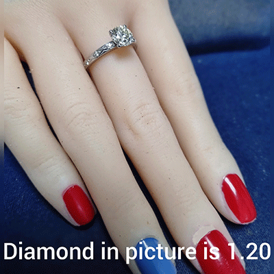 Leaf motif vintage style engagement ring with side diamonds