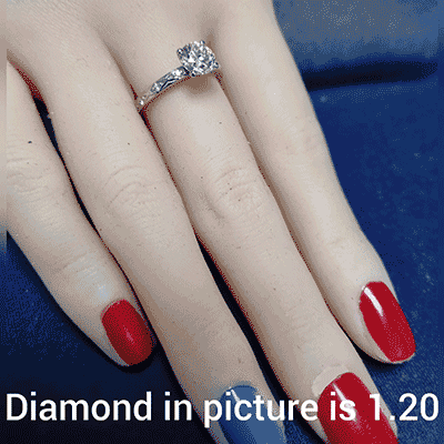 Leaf motif vintage style engagement ring with side diamonds