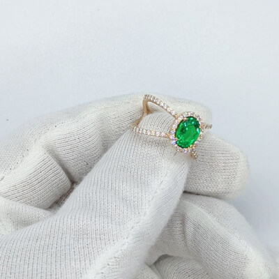 1.20 Emerald  Oval shape, X ring set with 1/2 carat side natural diamonds  average G VS