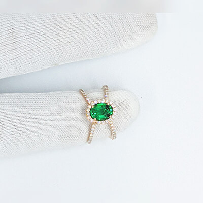 1.20 Emerald  Oval shape, X ring set with 1/2 carat side natural diamonds  average G VS