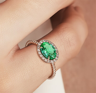 11/4 carat Oval Emerald and 1/5 carat round diamonds