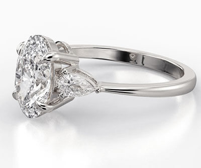 Three stone engagement ring with 0.20CTW side Pear diamonds