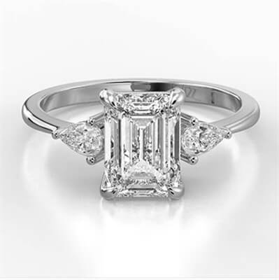 Three stone engagement ring with 0.20CTW side Pear diamonds