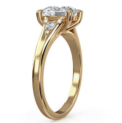Oval engagement ring with split band and side diamonds