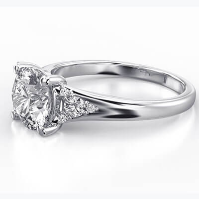 Round diamond engagement ring with split band and side diamonds