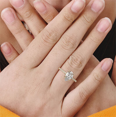 Low profile pear shaped diamond engagement ring