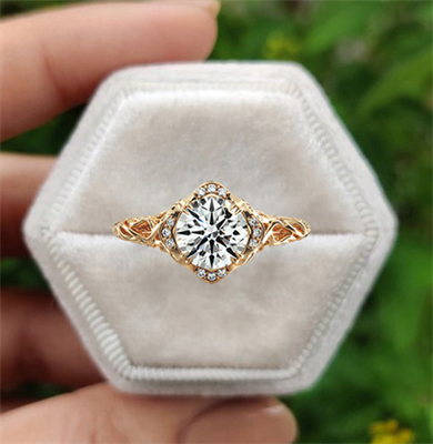 This delicate filigree vintage style engagement ring, 