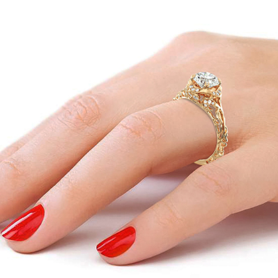 This delicate filigree vintage style engagement ring, 