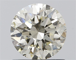Picture of Natural Diamond 0.90 Carats, Round with Excellent Cut, J Color, SI1 Clarity and Certified by IGI