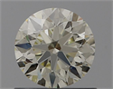 Natural Diamond 0.72 Carats, Round with Excellent Cut, M Color, IF Clarity and Certified by IGI