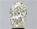 Natural Diamond 3.03 Carats, Oval with  Cut, K Color, SI2 Clarity and Certified by GIA