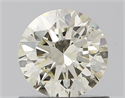 Natural Diamond 0.72 Carats, Round with Excellent Cut, J Color, SI1 Clarity and Certified by IGI