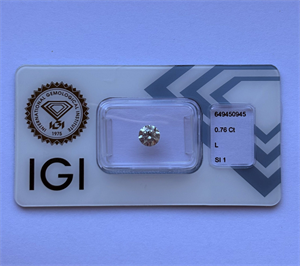 Picture of Natural Diamond 0.76 Carats, Round with Excellent Cut, L Color, SI1 Clarity and Certified by IGI